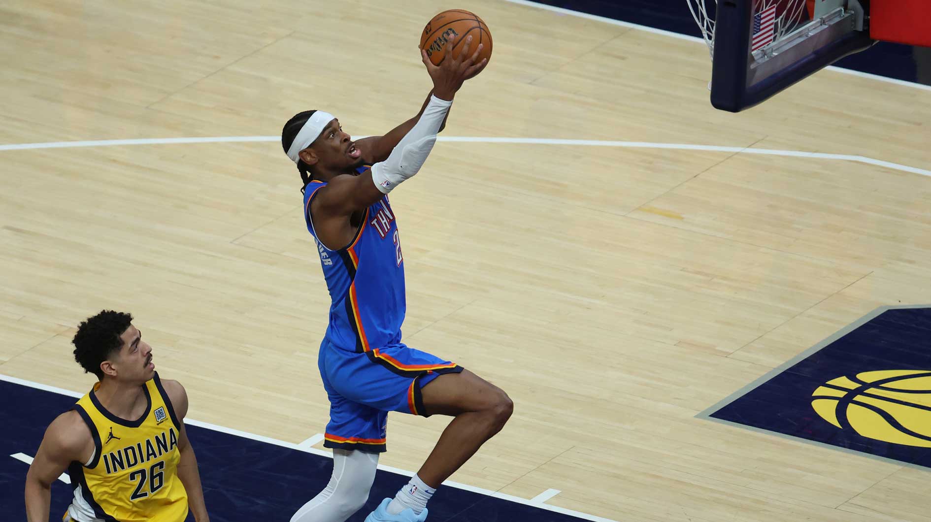 Thunder guard Shai Gilgeous-Alexander (2) dunks past Indiana Pacers guard Ben Sheppard (26) during the third quarter against the Indiana Pacers during game four of the 2025 NBA Finals at Gainbridge Fieldhouse