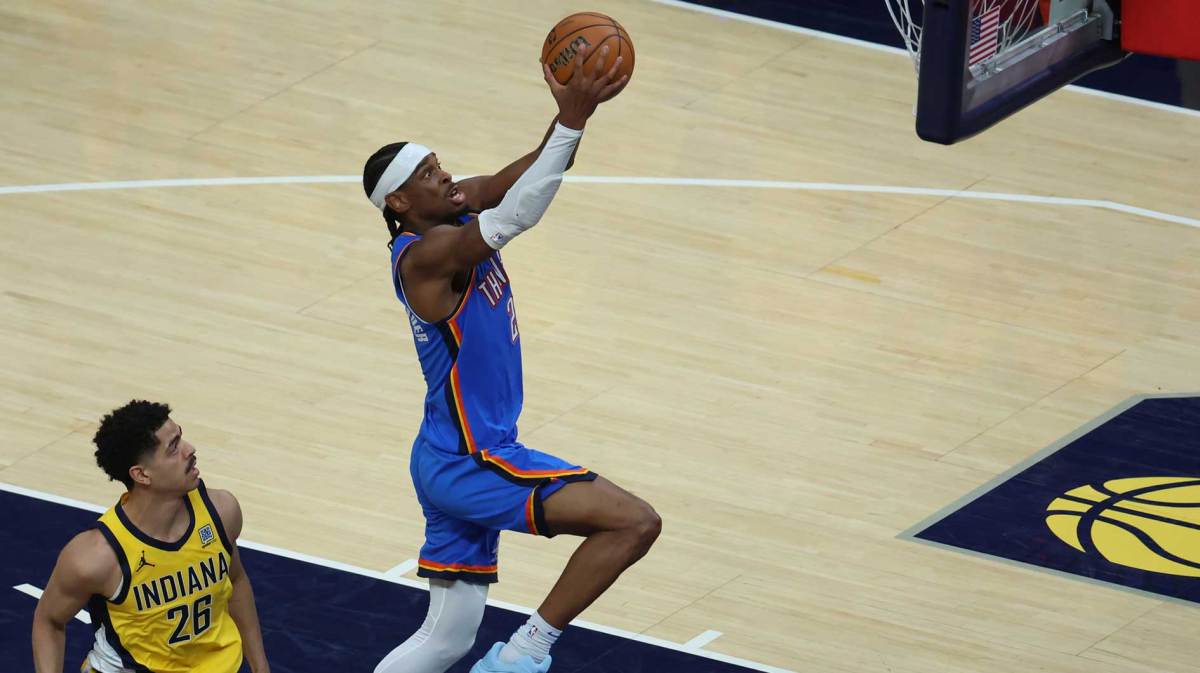 Thunder guard Shai Gilgeous-Alexander (2) dunks past Indiana Pacers guard Ben Sheppard (26) during the third quarter against the Indiana Pacers during game four of the 2025 NBA Finals at Gainbridge Fieldhouse