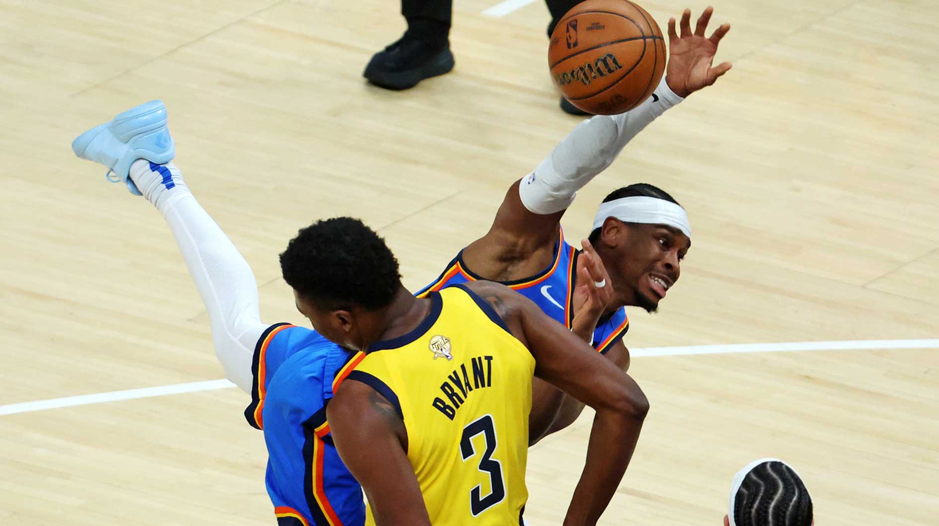 Thunder guard Shai Gilgeous-Alexander (2) drives to the basket against Indiana Pacers center Thomas Bryant (3) during the fourth quarter in game three of the 2025 NBA Finals at Gainbridge Fieldhouse