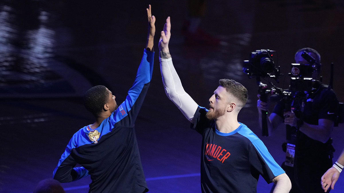 Thunder center Isaiah Hartenstein (right) is introduced prior to game five of the 2025 NBA Finals against the Indiana Pacers at Paycom Center