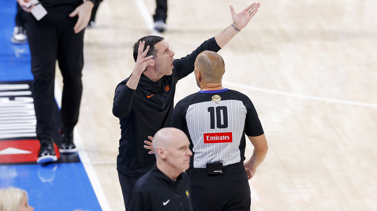 Thunder head coach Mark Daigneault argues a call with referee John Goble (10) as Indiana Pacers head coach Rick Carlisle looks on during the fourth quarter in game five of the 2025 NBA Finals at Paycom Center