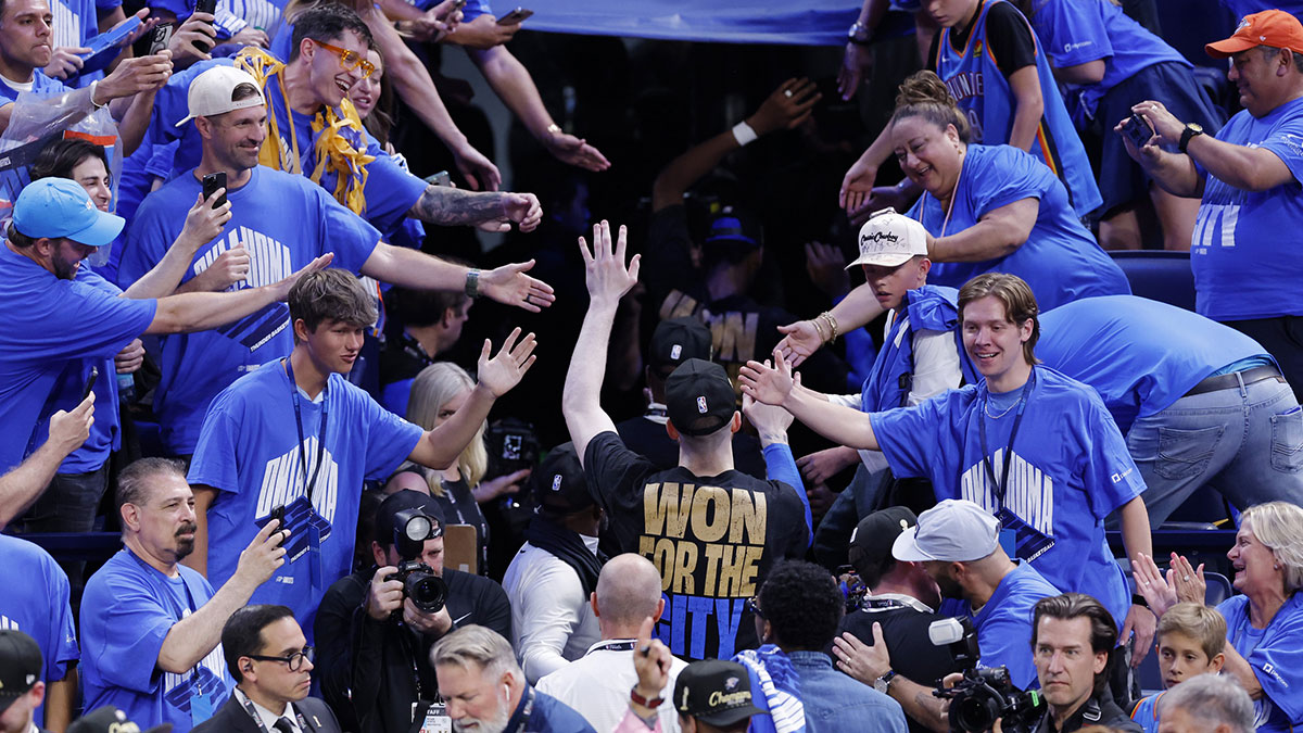 Thunder forward Chet Holmgren (7) greets fans as he walks off tthe court after winning game seven of the 2025 NBA Finals against the Indiana Pacers at Paycom Center