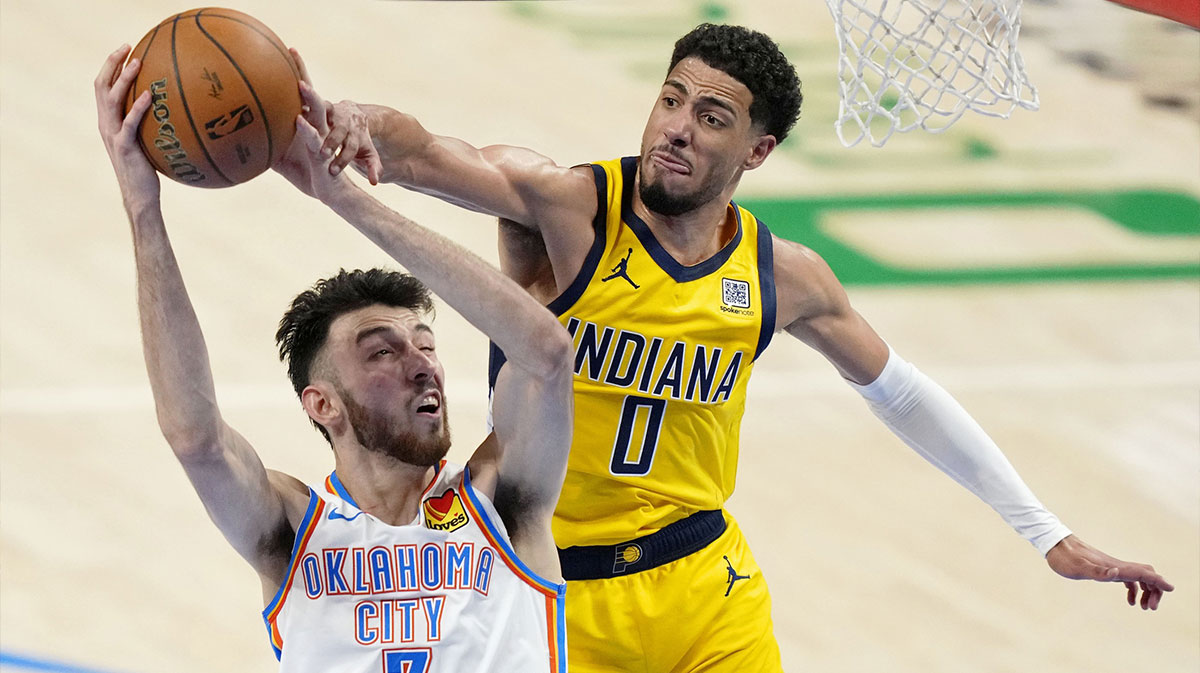Thunder forward Chet Holmgren (7) shoots the ball against Indiana Pacers guard Tyrese Haliburton (0) during the second quarter in game one of the 2025 NBA Finals at Paycom Center