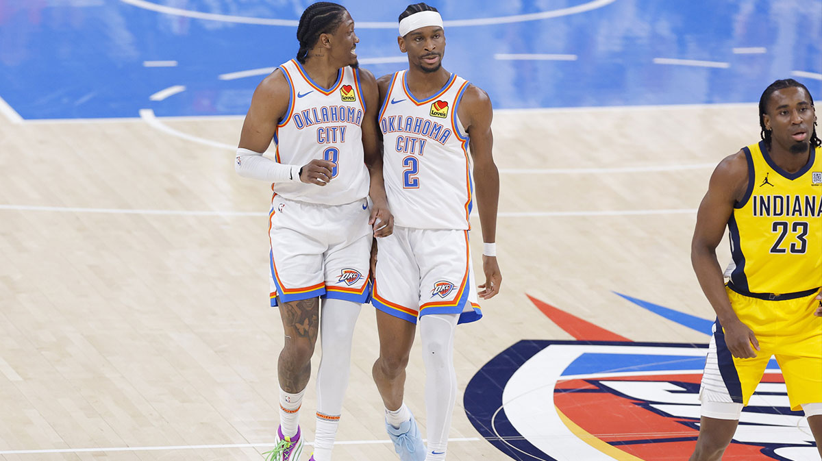 Oklahoma City Thunder forward Jalen Williams (8) and guard Shai Gilgeous-Alexander (2) walk back up the court in the first quarter against the Indiana Pacers during game five of the 2025 NBA Finals at Paycom Center.