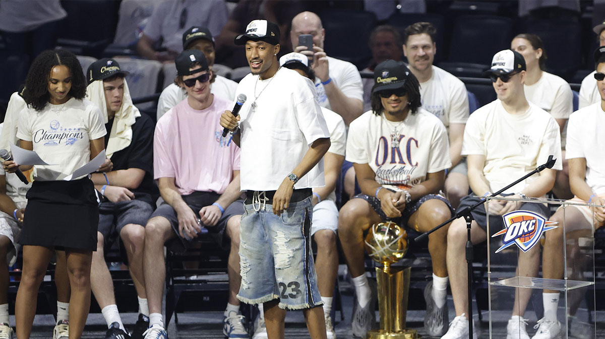 Thunder guard Aaron Wiggins (21) speaks to fans during the Champions Opening Ceremony for the parade inside the Paycom Center