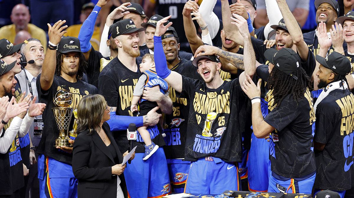 Thunder guard Alex Caruso (9) celebrates after winning game seven of the 2025 NBA Finals against the Indiana Pacers at Paycom Center with the Lakers logo in the background