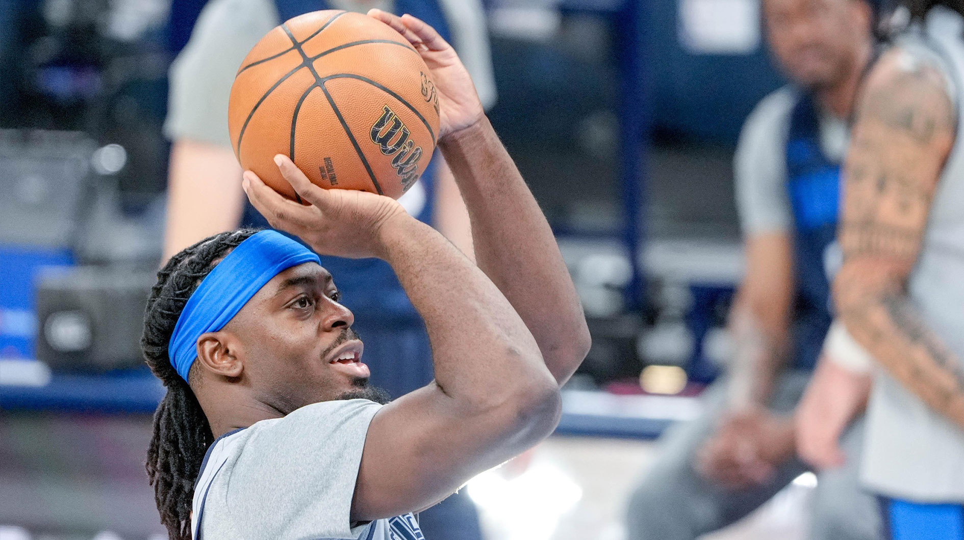 Thunder guard Lu Dort (5) shoots during an NBA Finals practice session with the Pacers logo in the background