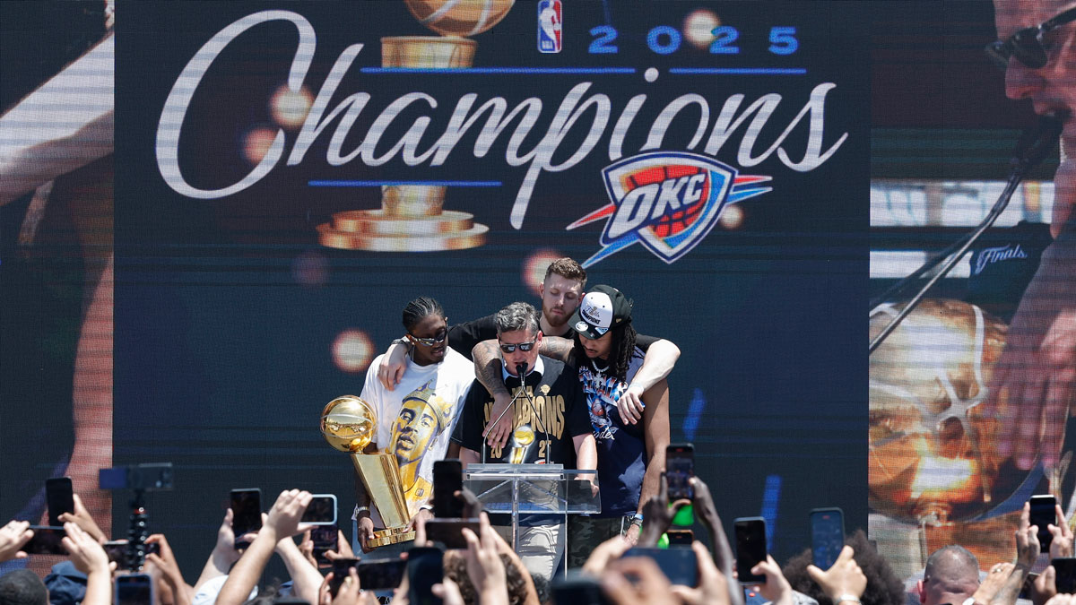 Oklahoma City Thunder forward Jalen Williams, left, Oklahoma City Thunder center Isaiah Hartenstein, back, and Oklahoma City Thunder forward Jaylin Williams, right, gather around Oklahoma City Mayor David Holt during the Oklahoma City Thunder Champions parade closing ceremony at Scissortail Park.