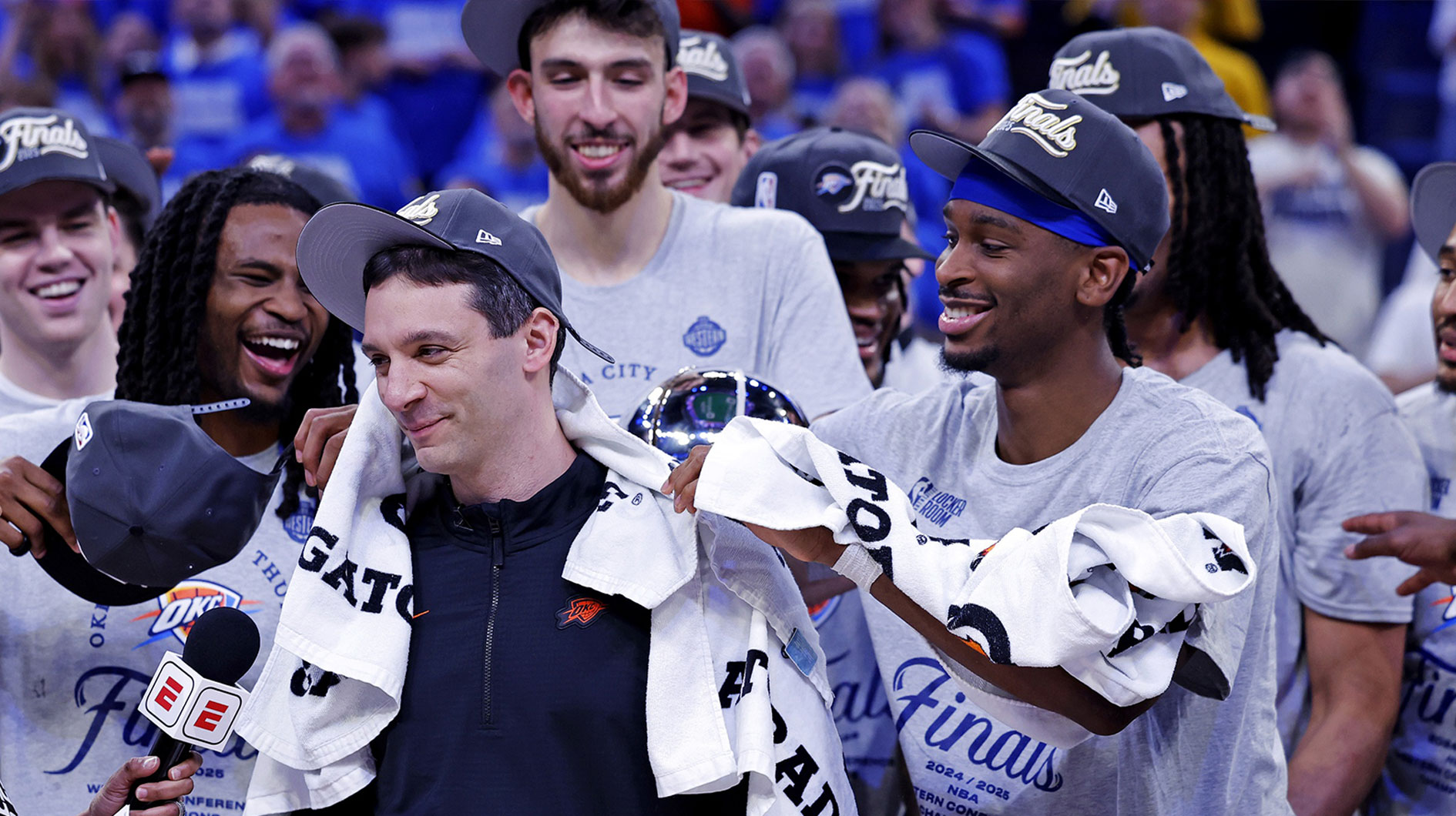 Thunder head coach Mark Daigneault celebrates with his team after defeating the Minnesota Timberwolves in game five to win the western conference finals for the 2025 NBA Playoffs at Paycom Center