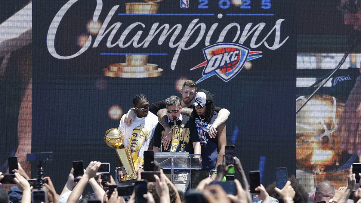 Oklahoma City Thunder forward Jalen Williams, left, Oklahoma City Thunder center Isaiah Hartenstein, back, and Oklahoma City Thunder forward Jaylin Williams, right, gather around Oklahoma City Mayor David Holt during the Oklahoma City Thunder Champions parade closing ceremony at Scissortail Park.