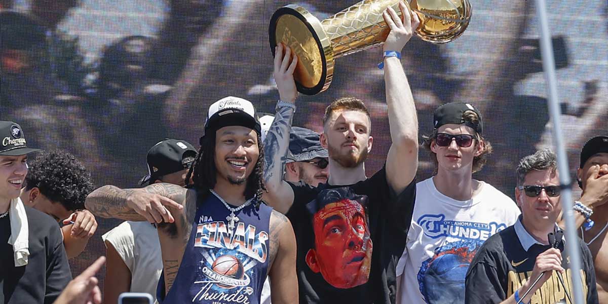 Oklahoma City Thunder center Isaiah Hartenstein holds the Larry O'Brien Championship Trophy during the Oklahoma City Thunder Champions parade. Mandatory Credit: Alonzo Adams-Imagn Images