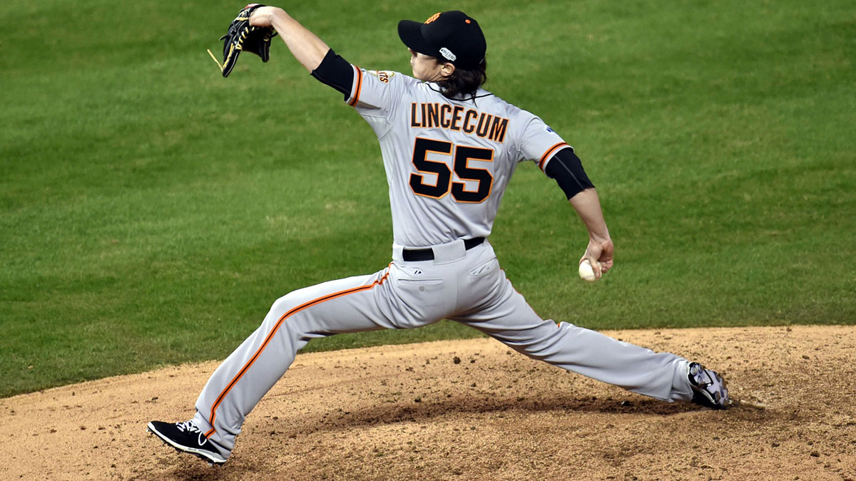 Jun 4, 2014; Cincinnati, OH, USA; San Francisco Giants starting pitcher Tim Lincecum (55) in the dugout during the eighth inning against the Cincinnati Reds at Great American Ball Park. The Giants defeated the Reds 3-2.