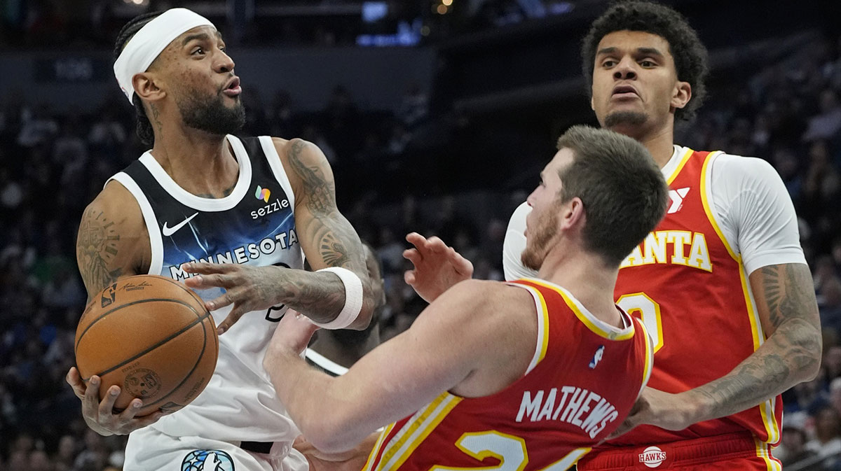 Minnesota Timberwolves forward Nickeil Alexander-Walker (9) charges into Atlanta Hawks forward Garrison Mathews (24) in the third quarter at Target Center.