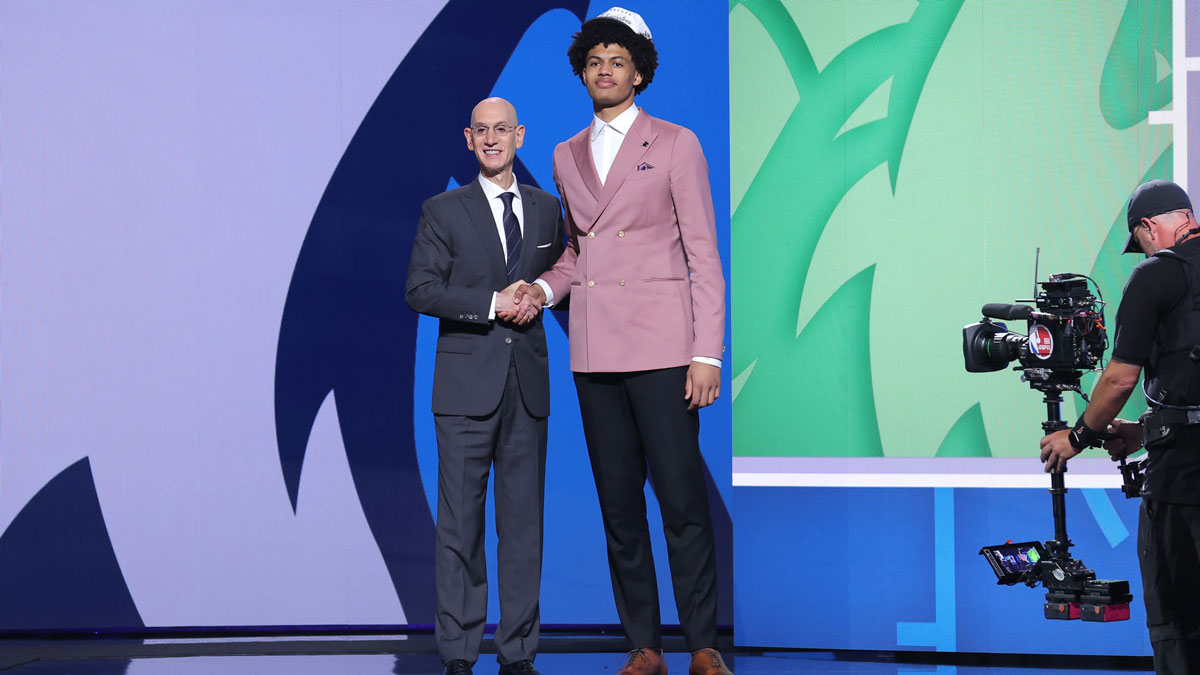 Joan Beringer stands with NBA commissioner Adam Silver after being selected as the 17th pick by the Minnesota Timberwolves in the first round of the 2025 NBA Draft at Barclays Center.