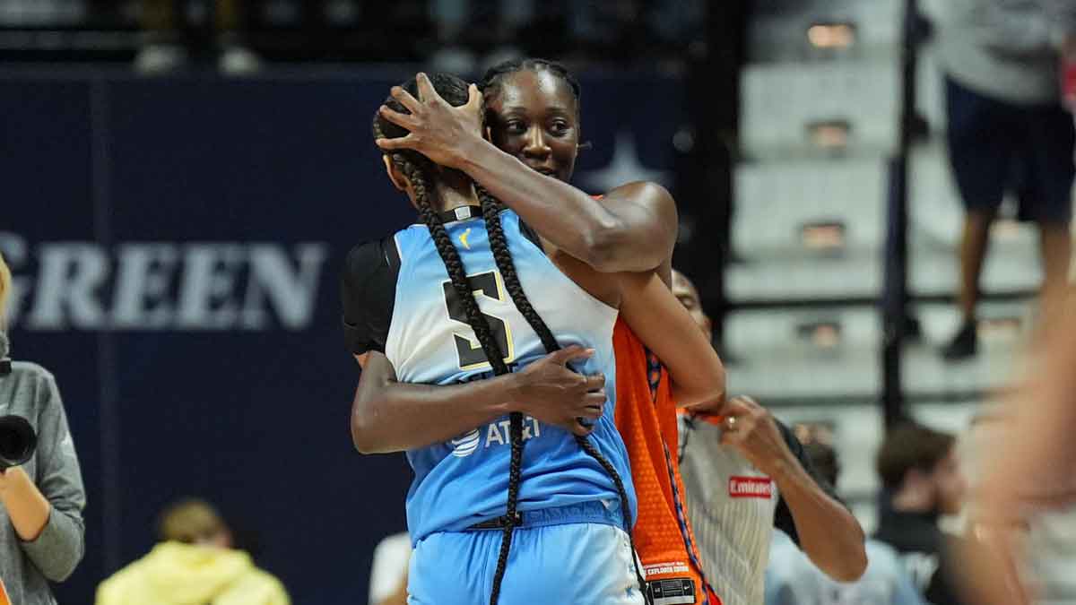 Chicago Sky forward Angel Reese (5) and Connecticut Sun center Tina Charles (31) hug after the game in the second half.