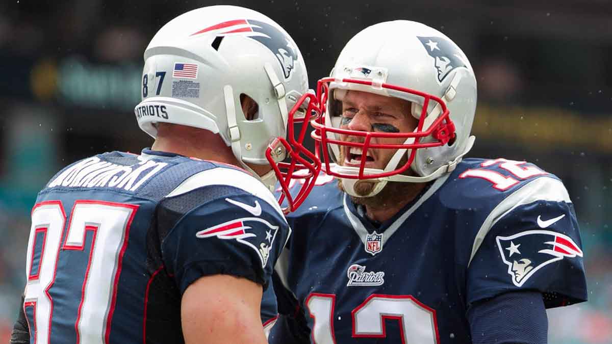 New England Patriots tight end Rob Gronkowski (87) and New England Patriots quarterback Tom Brady (12) celebrate a touchdown in the second quarter at Sun Life Stadium in Miami Gardens
