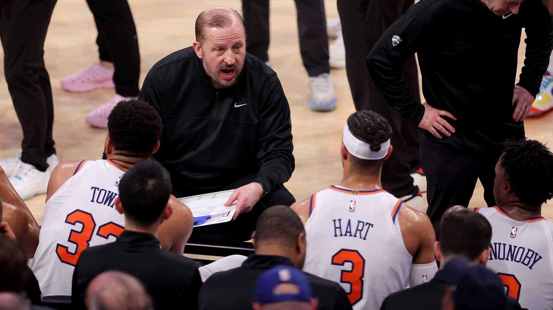 New York Knicks head coach Tom Thibodeau talks to center Karl-Anthony Towns (32) and guard Josh Hart (3) and forward OG Anunoby (8) during a time out during the third quarter of game six in the second round of the 2025 NBA Playoffs against the Boston Celtics at Madison Square Garden.