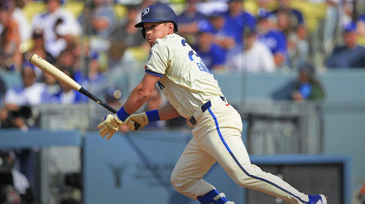 Los Angeles Dodgers second baseman Tommy Edman (25) hits a RBI double against the New York Yankees at Dodger Stadium.