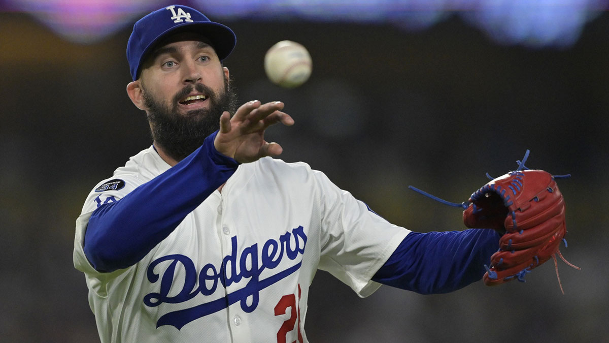 Los Angeles Dodgers starting pitcher Tony Gonsolin (26) throws New York Mets catcher Luis Torrens (13) out at first in the fifth inning at Dodger Stadium.