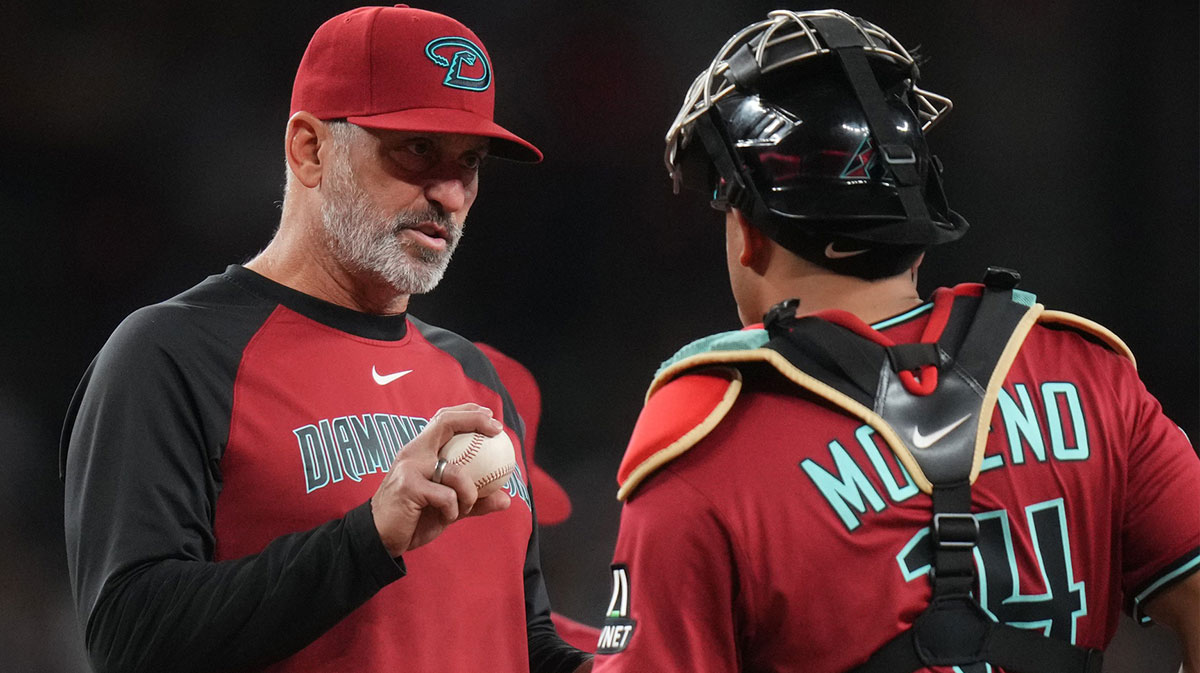Arizona Diamondbacks manager Torey Lovullo talks to catcher Gabriel Moreno (14) during their game against the Seattle Mariners at Chase Field in Phoenix, on June 10, 2025.
