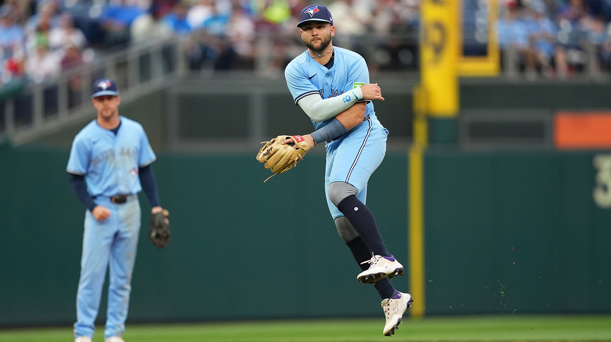 Toronto Blue Jays infielder Bo Bichette (11) throws to first against the Philadelphia Phillies in the seventh inning at Citizens Bank Park. Gimenez Varsho