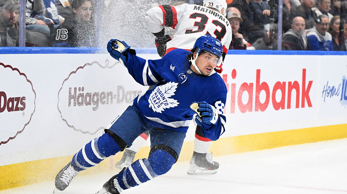 Toronto Maple Leafs forward Nick Robertson (89) pivots away from a bodycheck from Ottawa Senators defenseman Nikolas Matinpalo (33) in the third period at Scotiabank Arena.