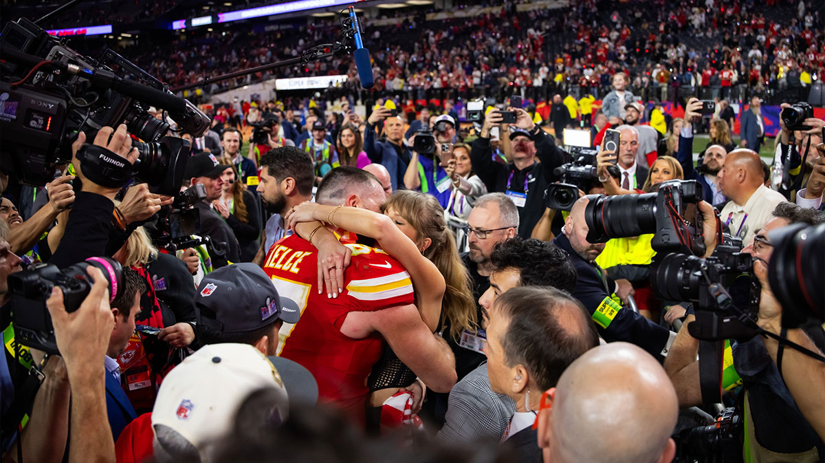 Travis Kelce and Taylor Swift, who fans speculated were married after seeing a fake wedding invite, after Super Bowl 58.