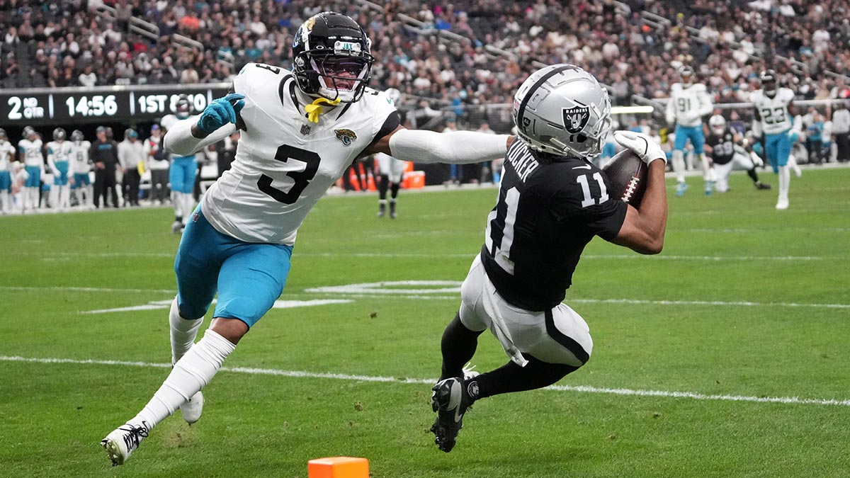 Las Vegas Raiders wide receiver Tre Tucker (11) makes a catch against Jacksonville Jaguars cornerback Tyson Campbell (3) in the first half at Allegiant Stadium.