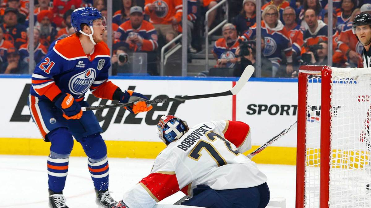 Edmonton Oilers center Trent Frederic (21) shoots the puck on Florida Panthers goaltender Sergei Bobrovsky (72) during the first period in game two of the 2025 Stanley Cup Final at Rogers Place.