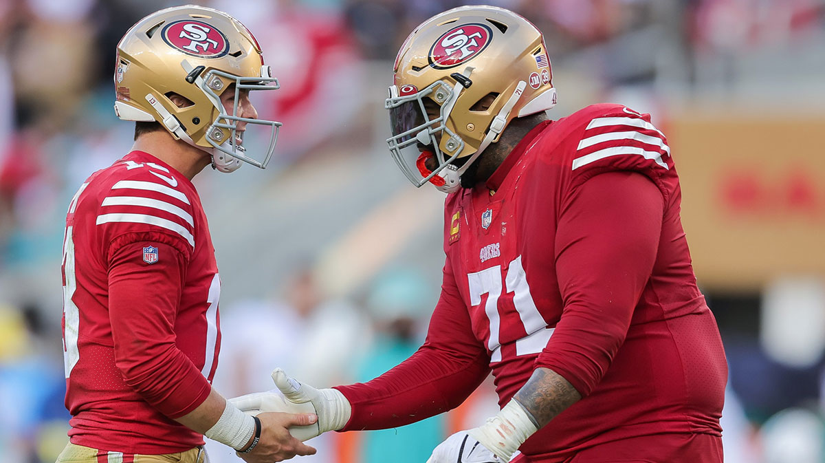 Dec 4, 2022; Santa Clara, California, USA; San Francisco 49ers quarterback Brock Purdy (13) celebrates with offensive tackle Trent Williams (71) after a touchdown during the second quarter at Levi's Stadium. Mandatory Credit: Sergio Estrada-Imagn Images