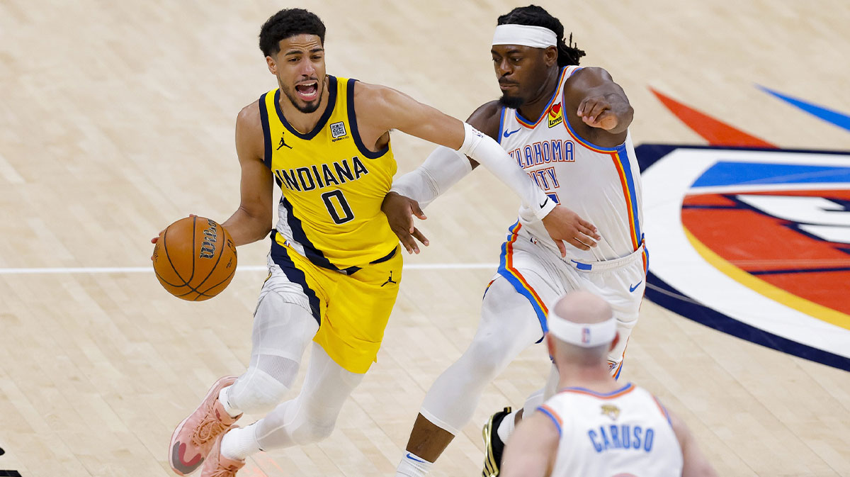 Indiana Pacers guard Tyrese Haliburton (0) drives to the basket past Oklahoma City Thunder guard Luguentz Dort (5) during the third quarter in game five of the 2025 NBA Finals at Paycom Center.