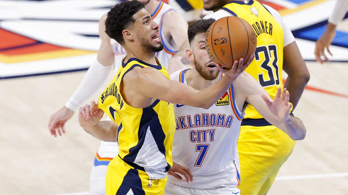 Indiana Pacers guard Tyrese Haliburton (0) drives to the basket past Oklahoma City Thunder forward Chet Holmgren (7) during the fourth quarter in game five of the 2025 NBA Finals at Paycom Center