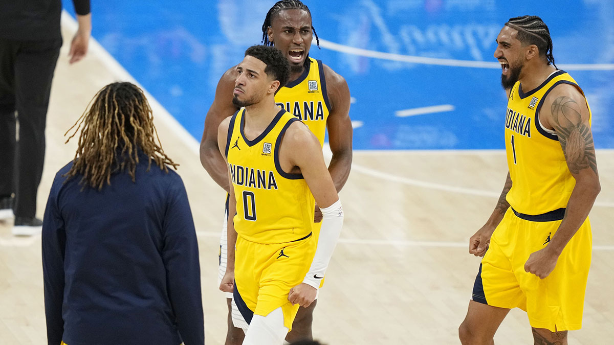 Indiana Pacers guard Tyrese Haliburton (0), forward Aaron Nesmith (center) and forward Obi Toppin (1) react after a play against the Oklahoma City Thunder in game one of the 2025 NBA Finals at Paycom Center.