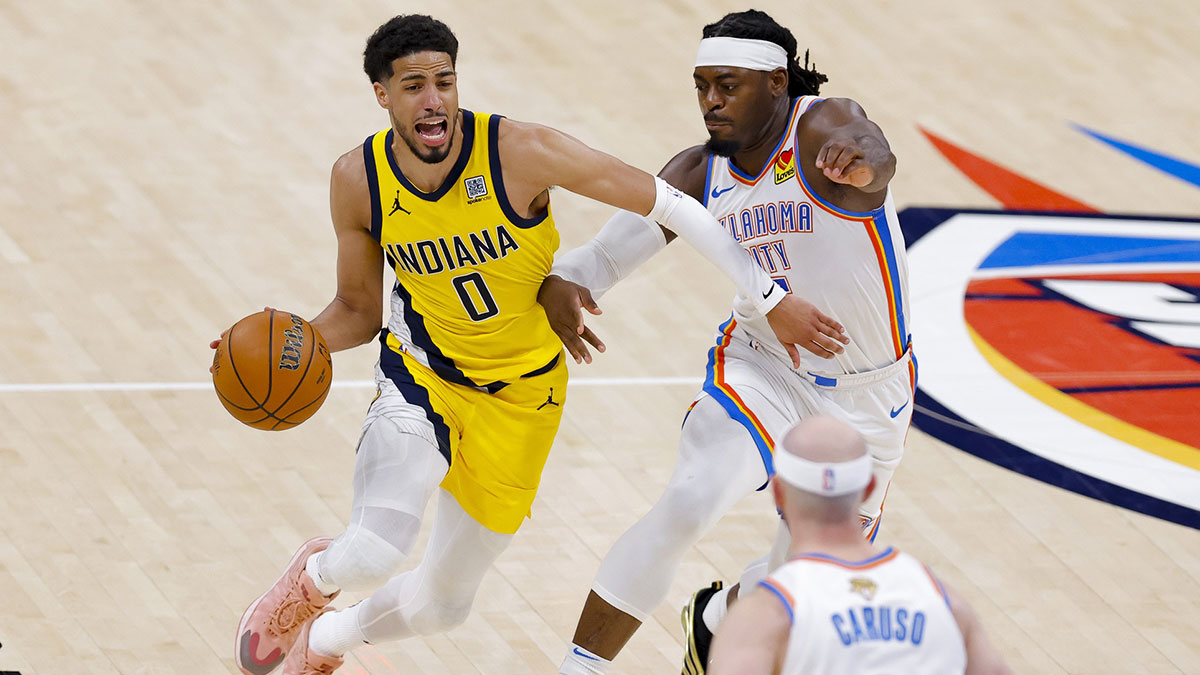 Indiana Pacers guard Tyrese Haliburton (0) drives to the basket past Oklahoma City Thunder guard Luguentz Dort (5) during the third quarter in game five of the 2025 NBA Finals at Paycom Center.