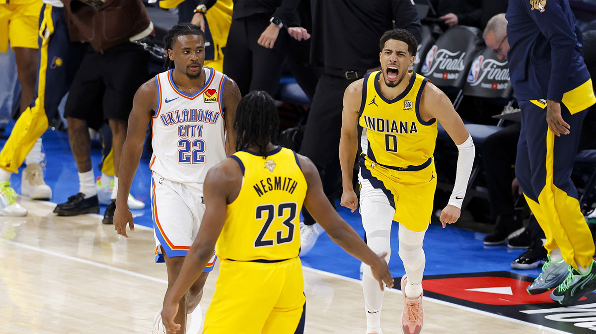 Indiana Pacers guard Tyrese Haliburton (0) and forward Aaron Nesmith (23) celebrate after Haliburton makes the game winning shot as Oklahoma City Thunder guard Cason Wallace (22) looks on during the fourth quarter during game one of the 2025 NBA Finals at Paycom Center.