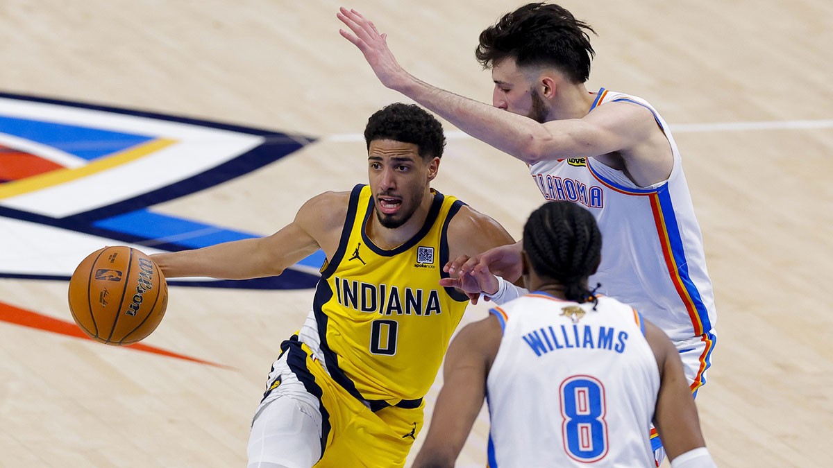 Indiana Pacers guard Tyrese Haliburton (0) drives to the basket past Oklahoma City Thunder forward Chet Holmgren (7) during the third quarter in game five of the 2025 NBA Finals at Paycom Center.