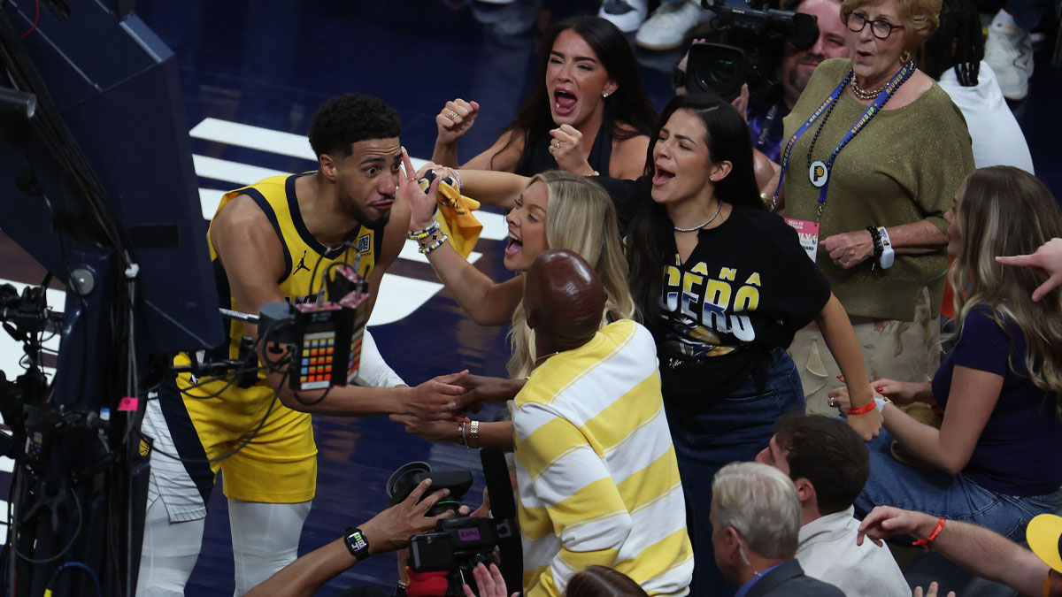 Indiana Pacers guard Tyrese Haliburton (0) reacts with his girlfriend Jade Jones and father John Haliburton following the second quarter against the Oklahoma City Thunder in game four of the 2025 NBA Finals at Gainbridge Fieldhouse.