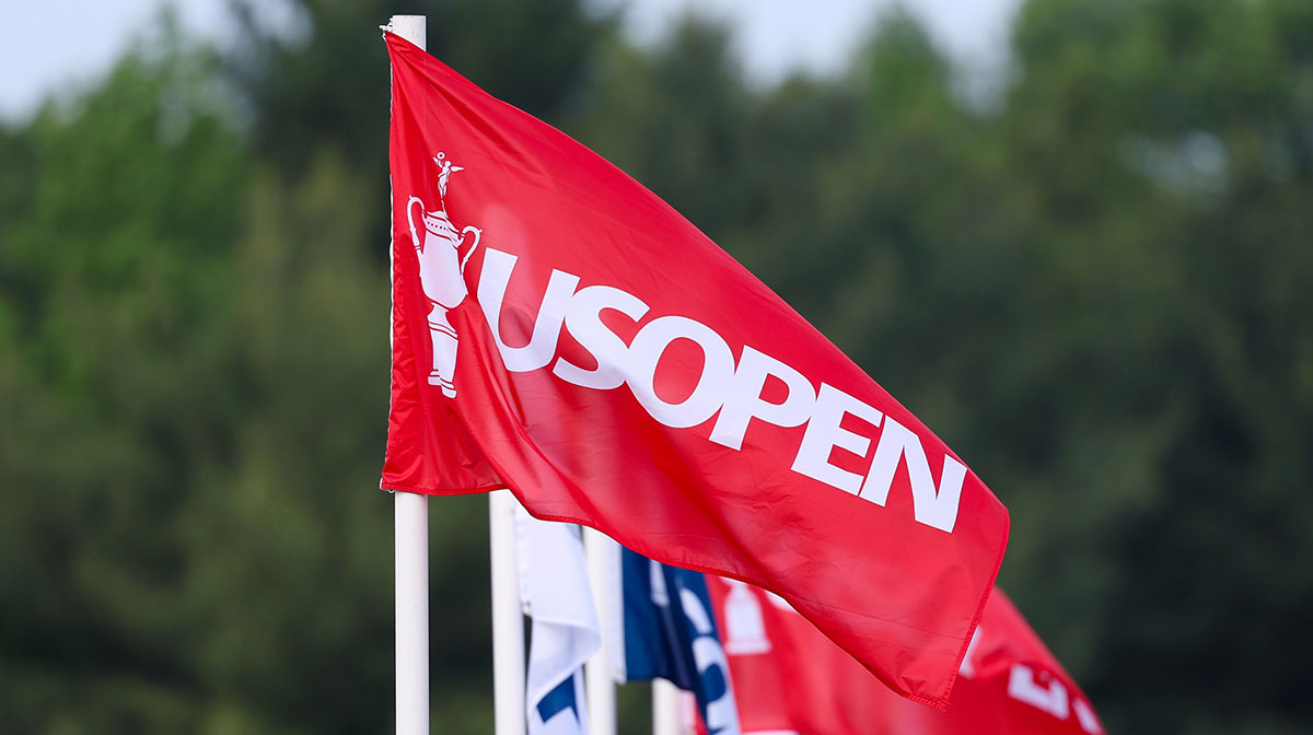 Jun 9, 2025; Oakmont, Pennsylvania, USA; US Open flags atop a grandstand during a practice round for the U.S. Open golf tournament at Oakmont Country Club.