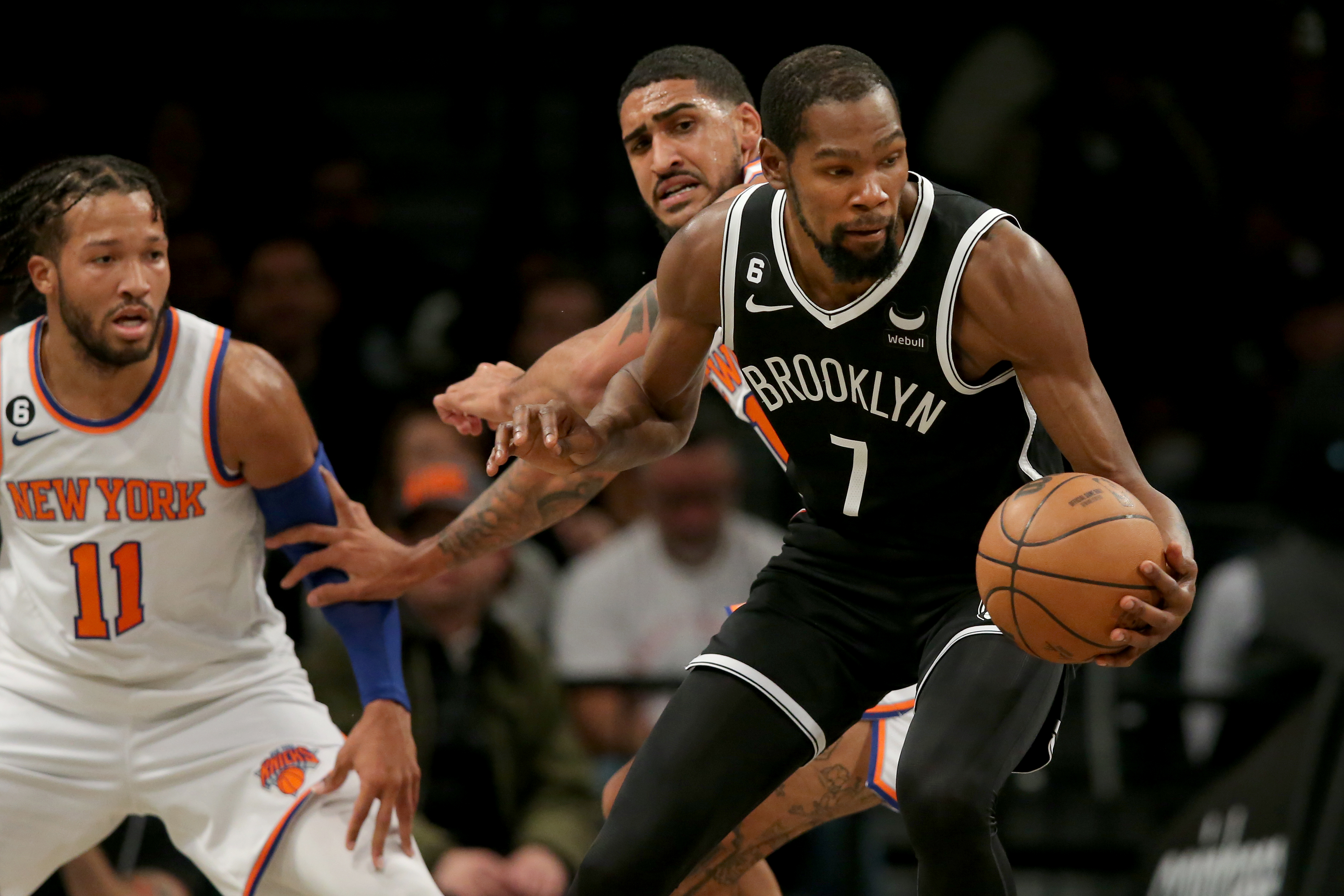 Brooklyn Nets forward Kevin Durant (7) controls the ball against New York Knicks guard Jalen Brunson (11) and forward Obi Toppin (1) during the second quarter at Barclays Center.