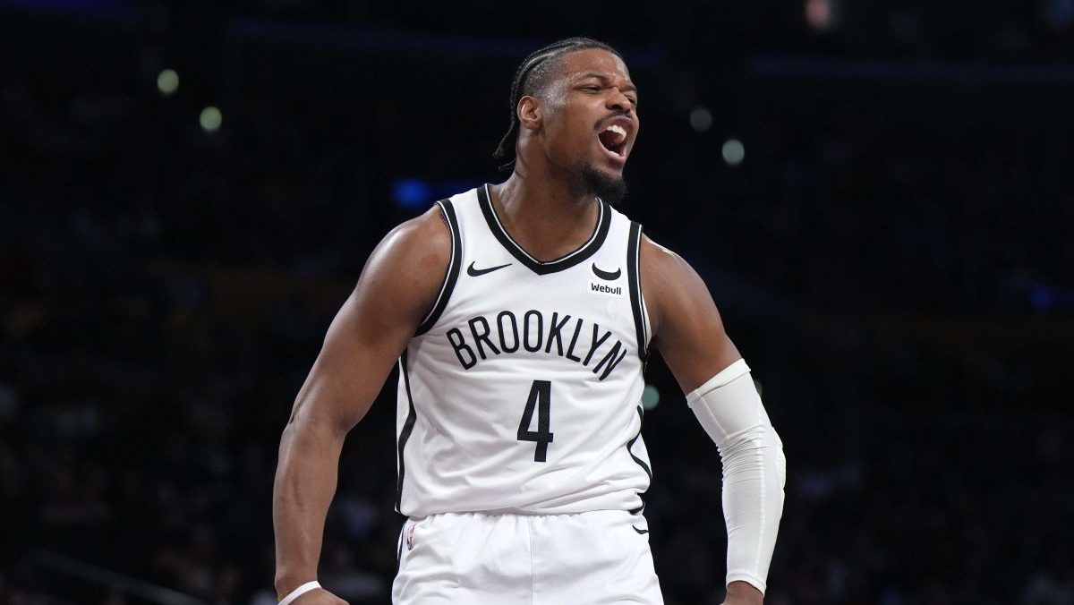Jan 19, 2024; Los Angeles, California, USA; Brooklyn Nets guard Dennis Smith Jr. (4) celebrates against the Los Angeles Lakers in the second half at Crypto.com Arena. Mandatory Credit: Kirby Lee-USA TODAY Sports