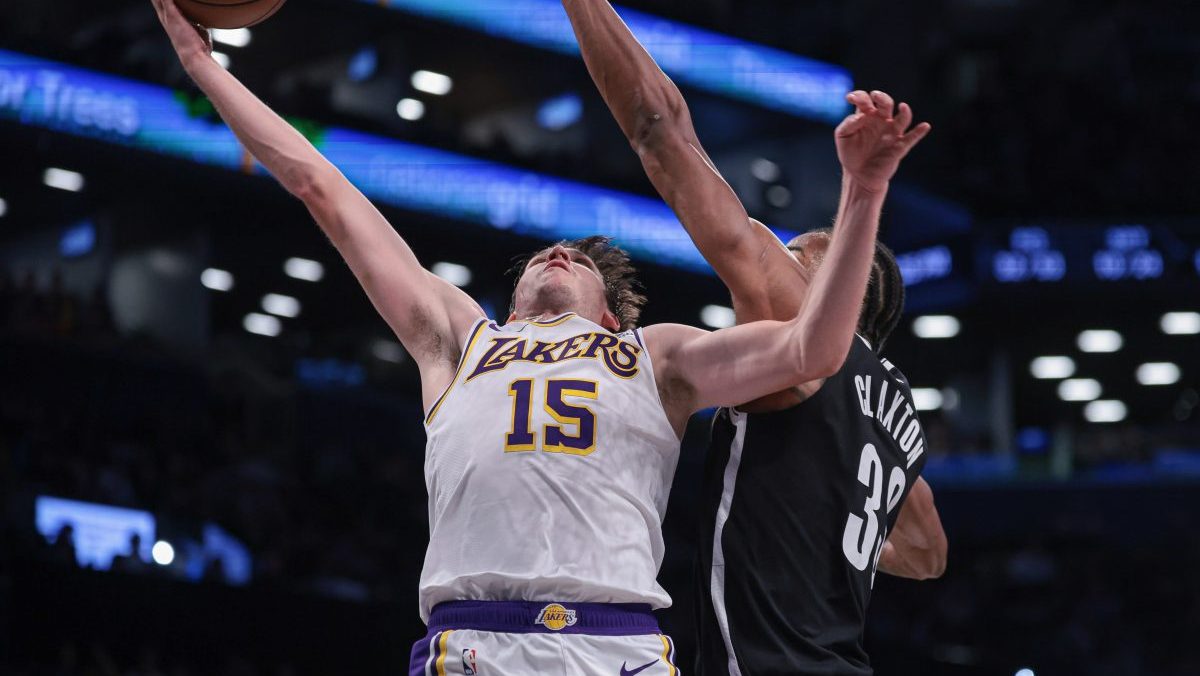 Mar 31, 2024; Brooklyn, New York, USA; Los Angeles Lakers guard Austin Reaves (15) drives for a shot against Brooklyn Nets center Nic Claxton (33) during the second half at Barclays Center. Mandatory Credit: Vincent Carchietta-USA TODAY Sports