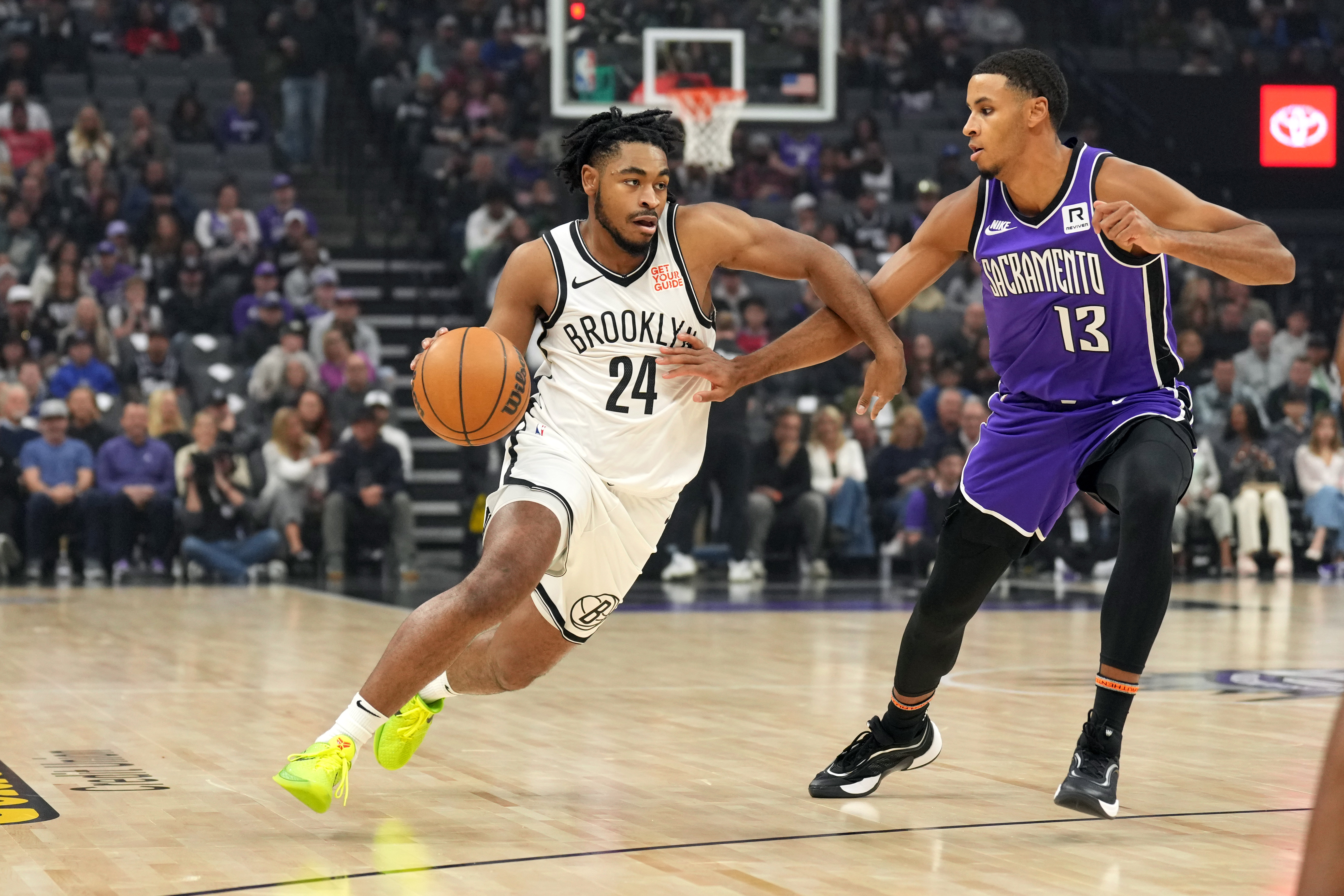 Brooklyn Nets guard Cam Thomas (24) dribbles against Sacramento Kings forward Keegan Murray (13) during the first quarter at Golden 1 Center.