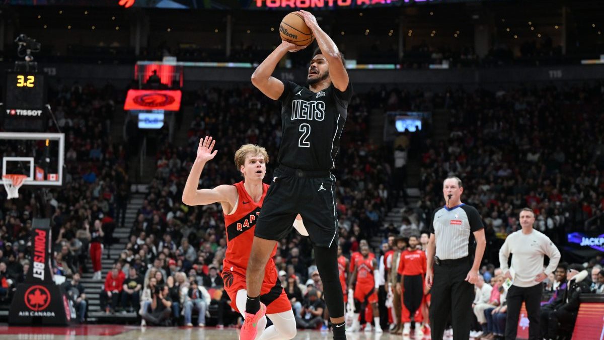 Brooklyn Nets forward Cam Johnson (2) shoots the ball over Toronto Raptors guard Gradey Dick (1) in the first half at Scotiabank Arena.