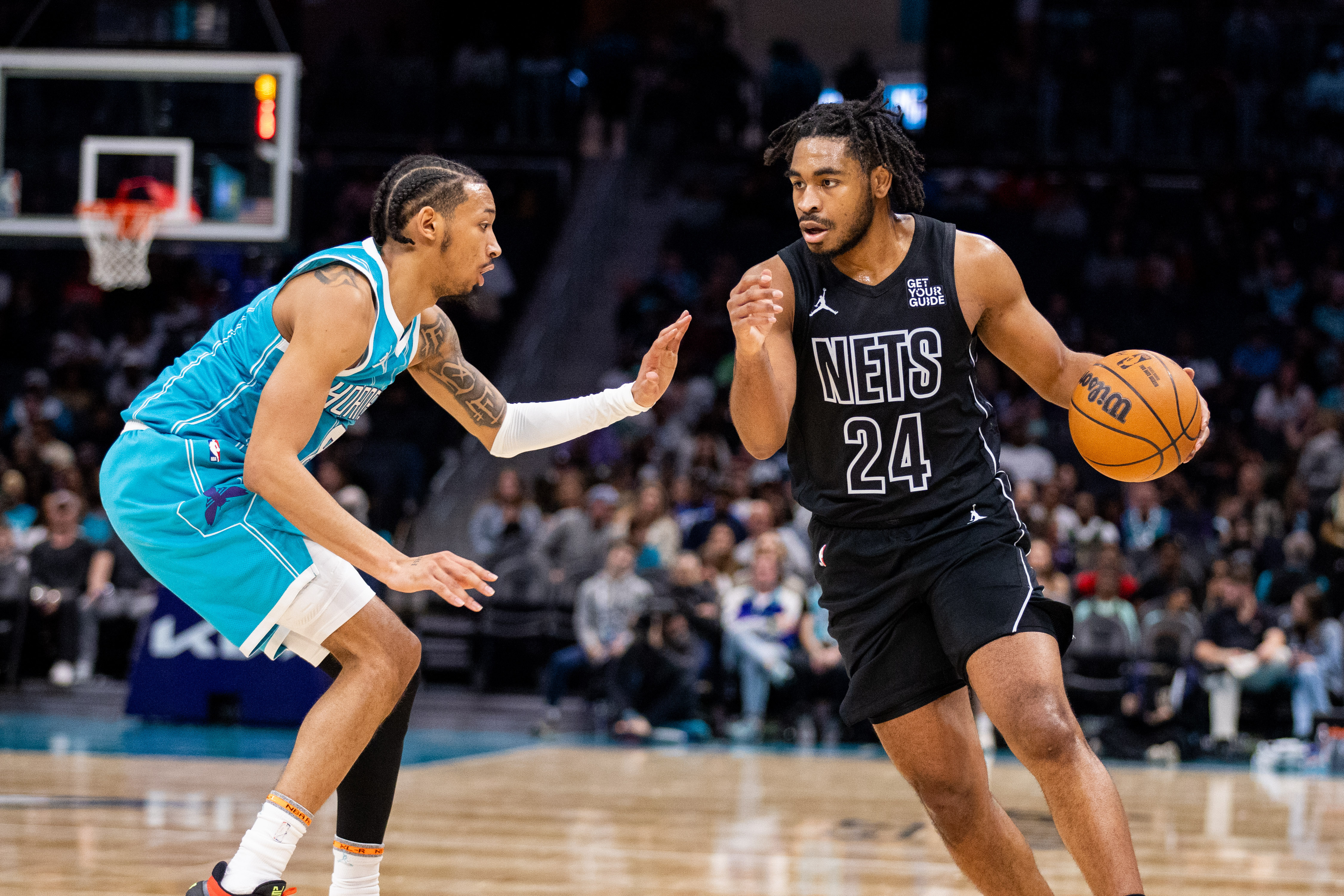 Brooklyn Nets guard Cam Thomas (24) drives on Charlotte Hornets guard Nick Smith Jr. (8) during the second quarter at Spectrum Center.