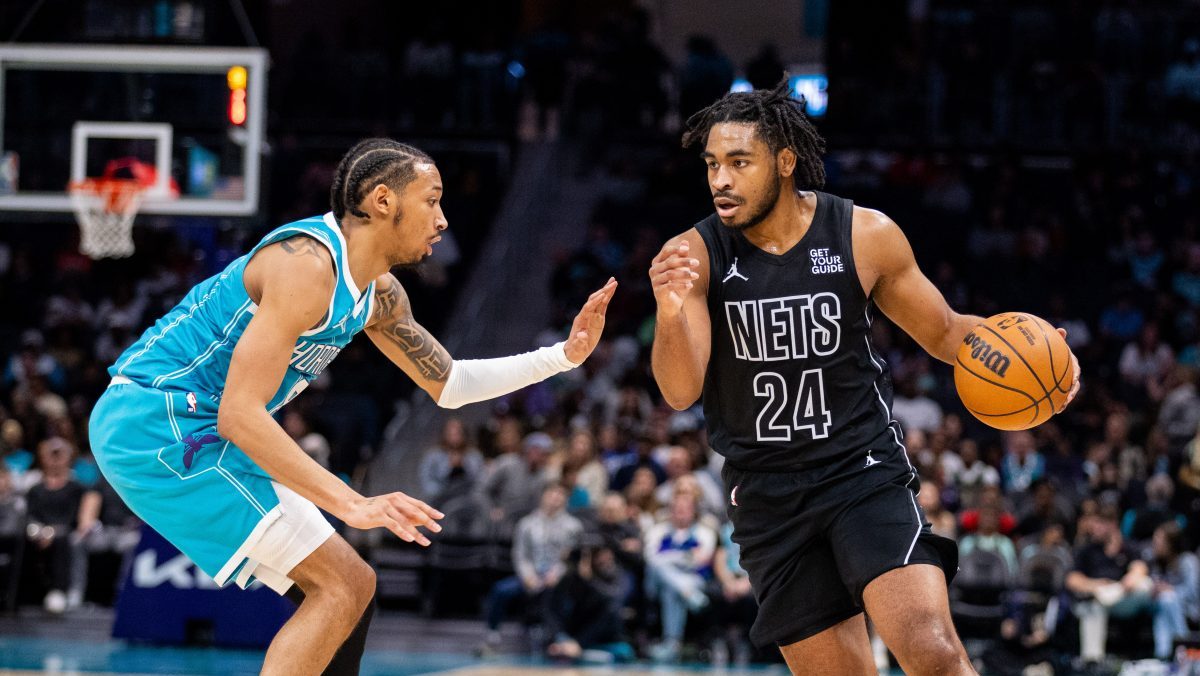 Mar 8, 2025; Charlotte, North Carolina, USA; Brooklyn Nets guard Cam Thomas (24) drives on Charlotte Hornets guard Nick Smith Jr. (8) during the second quarter at Spectrum Center. Mandatory Credit: Scott Kinser-Imagn Images