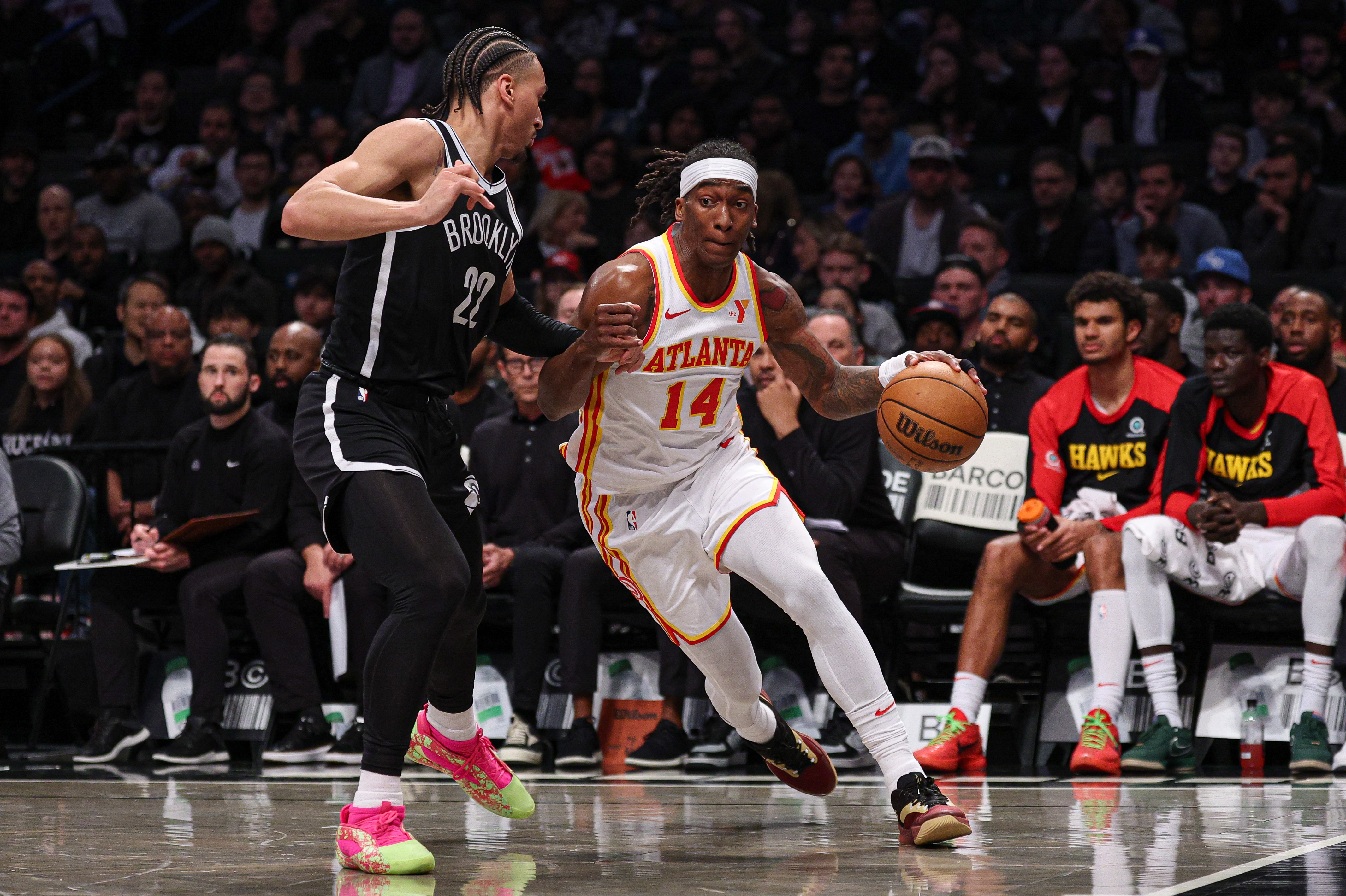 Atlanta Hawks guard Terance Mann (14) goes to the basket as Brooklyn Nets forward Jalen Wilson (22) during the first half at Barclays Center.