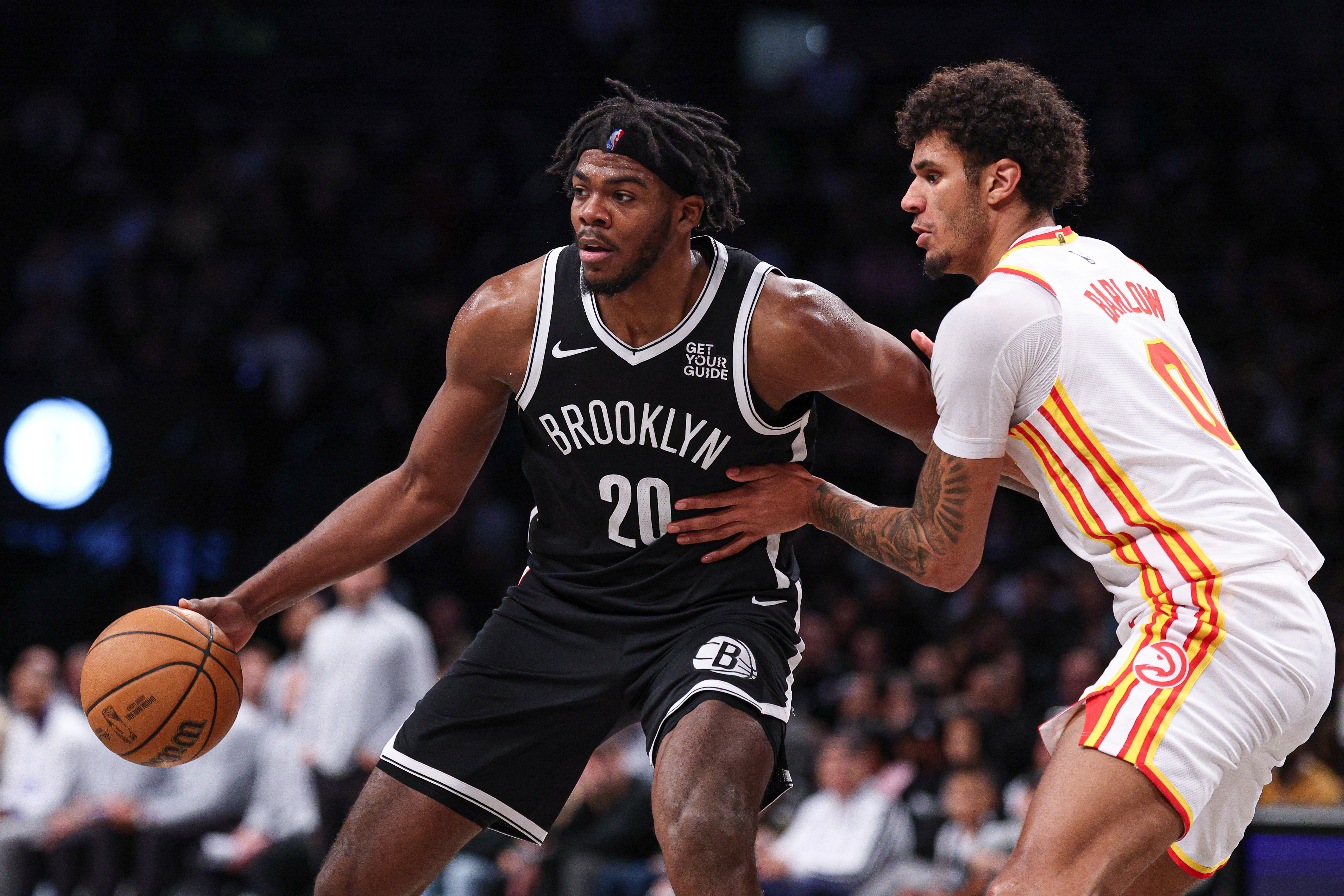 Brooklyn Nets center Day'Ron Sharpe (20) is defended by Atlanta Hawks forward Dominick Barlow (0) during the second half at Barclays Center.