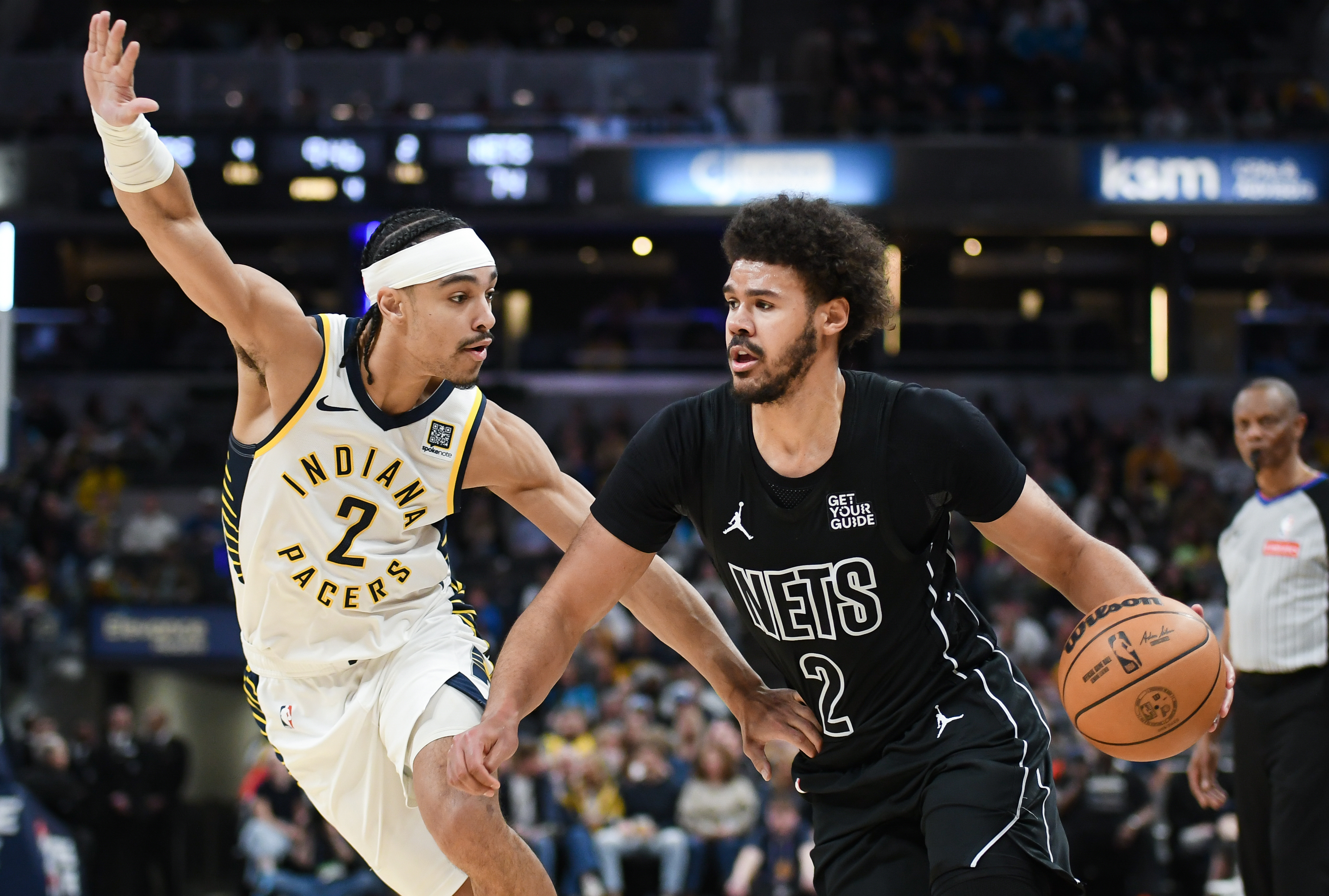 Brooklyn Nets forward Cameron Johnson (2) goes to the basket against Indiana Pacers guard Andrew Nembhard (2) during the second half at Gainbridge Fieldhouse.