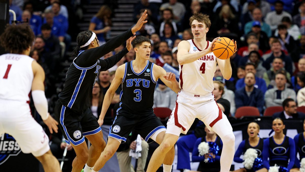 Alabama Crimson Tide forward Grant Nelson (4) passes the ball against Brigham Young Cougars guard Egor Demin (3) during the first half during an East Regional semifinal of the 2025 NCAA tournament at Prudential Center.