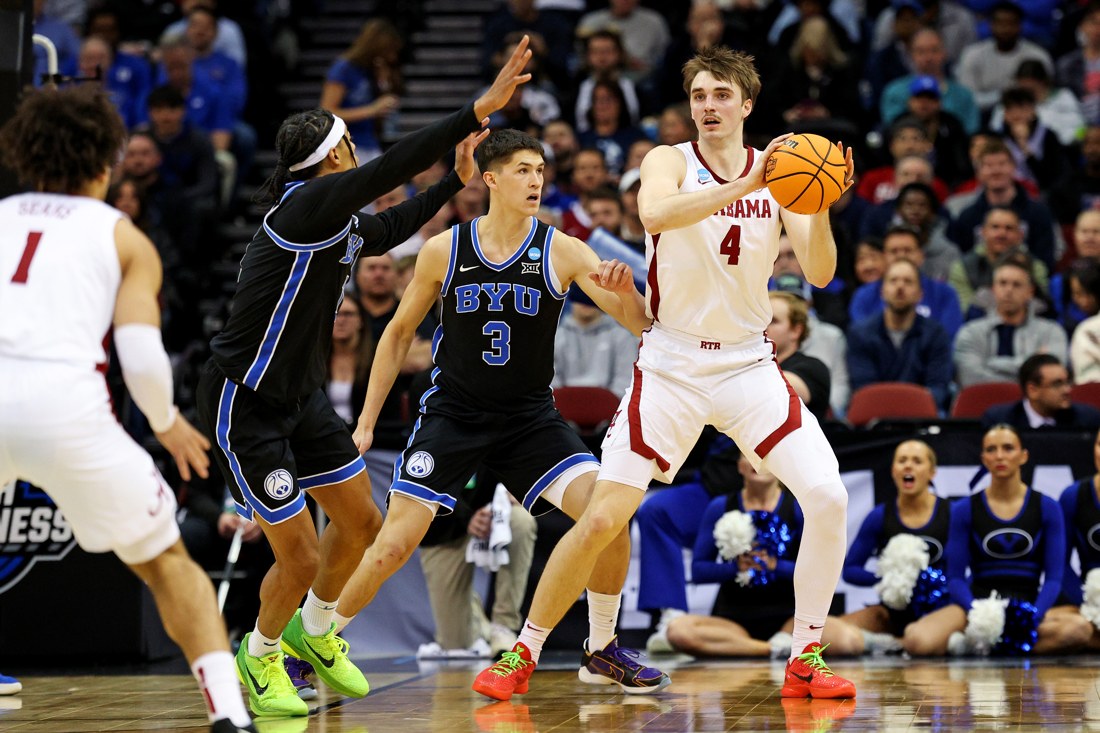 Alabama Crimson Tide forward Grant Nelson (4) passes the ball against Brigham Young Cougars guard Egor Demin (3) during the first half during an East Regional semifinal of the 2025 NCAA tournament at Prudential Center.